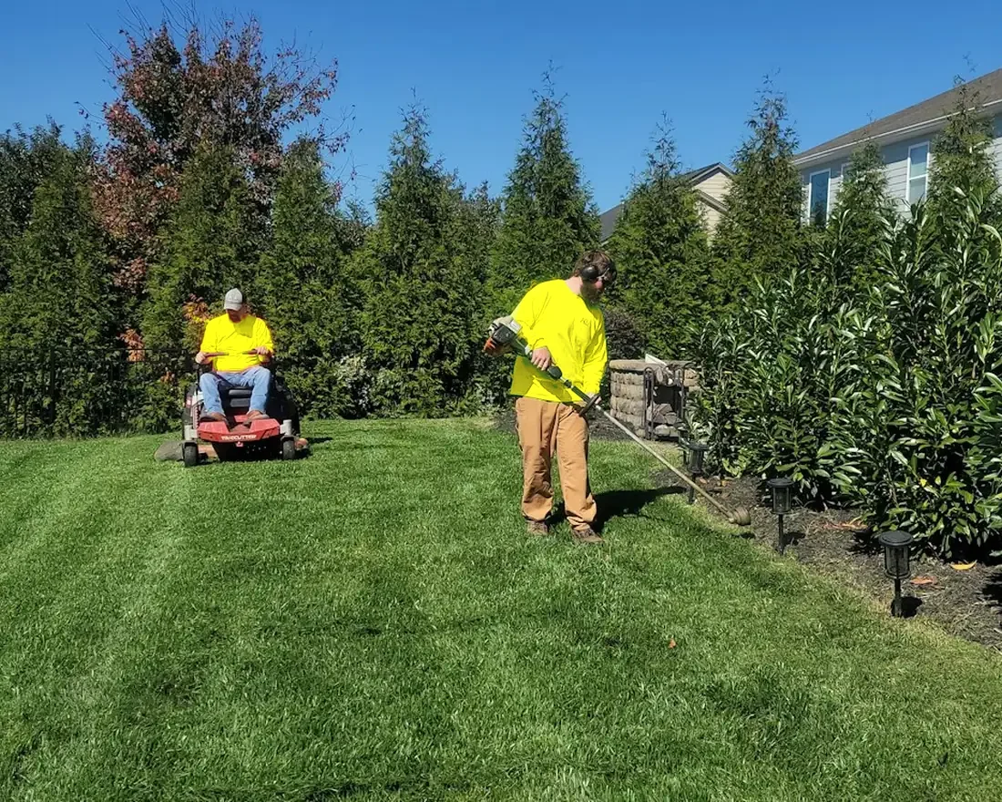 A lawn-care crew on their weekly visit to a client's yard